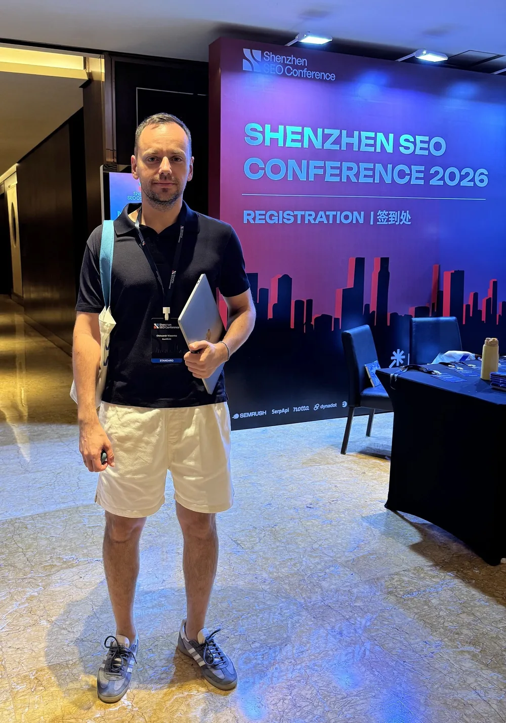 Oleksandr Vlasenko at the conference registration desk
